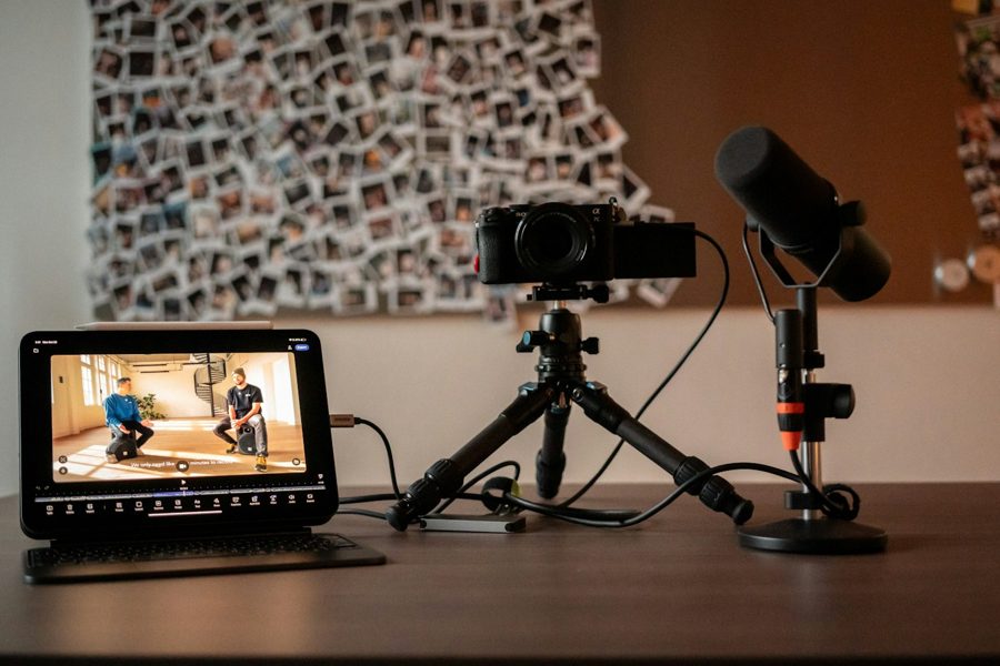 A camera, microphone, and monitor set up to record a lesson